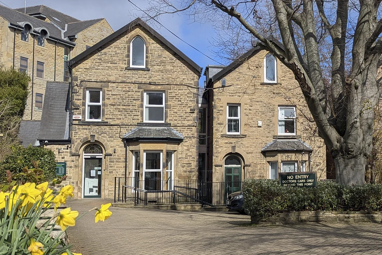 The front entrance and car park of Nethergreen Surgery